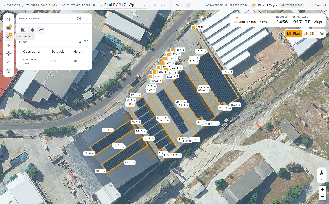 Obstructions rail open beside arrays on the warehouse roofs